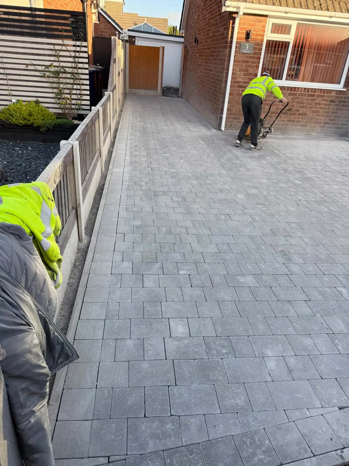 Block paved side path being finished