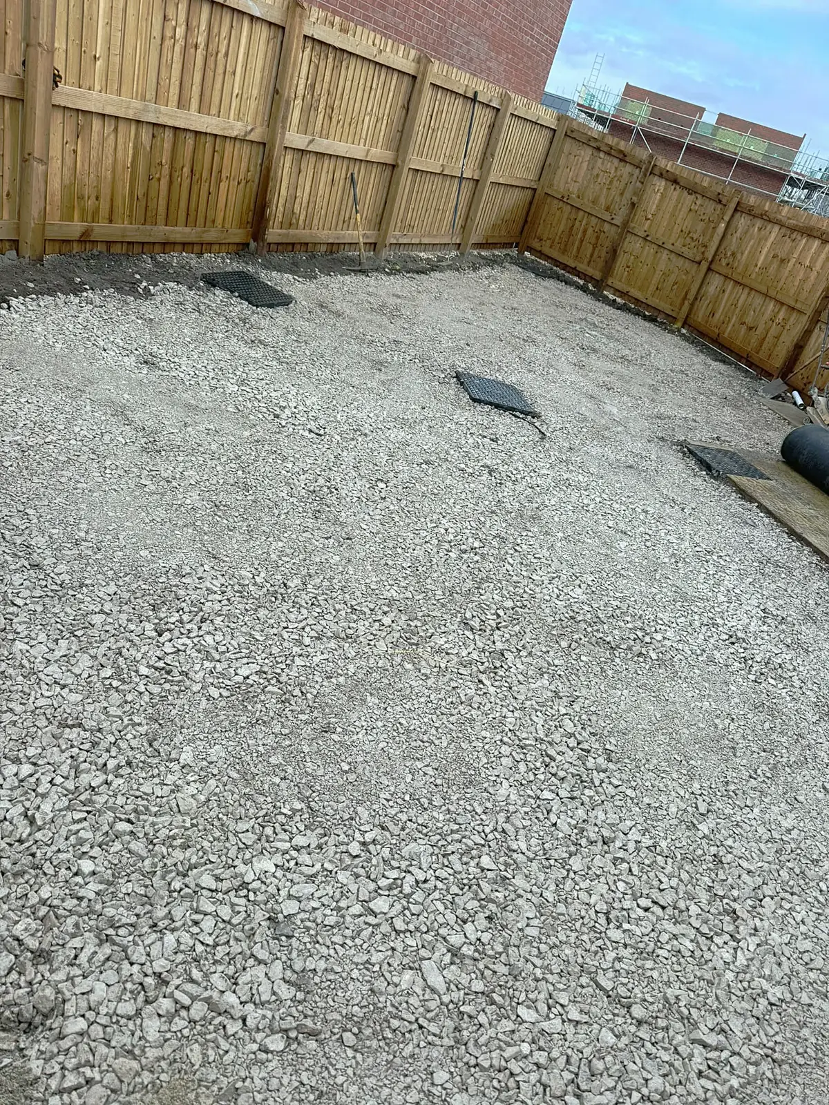 Compacted stone sub-base in a rear garden