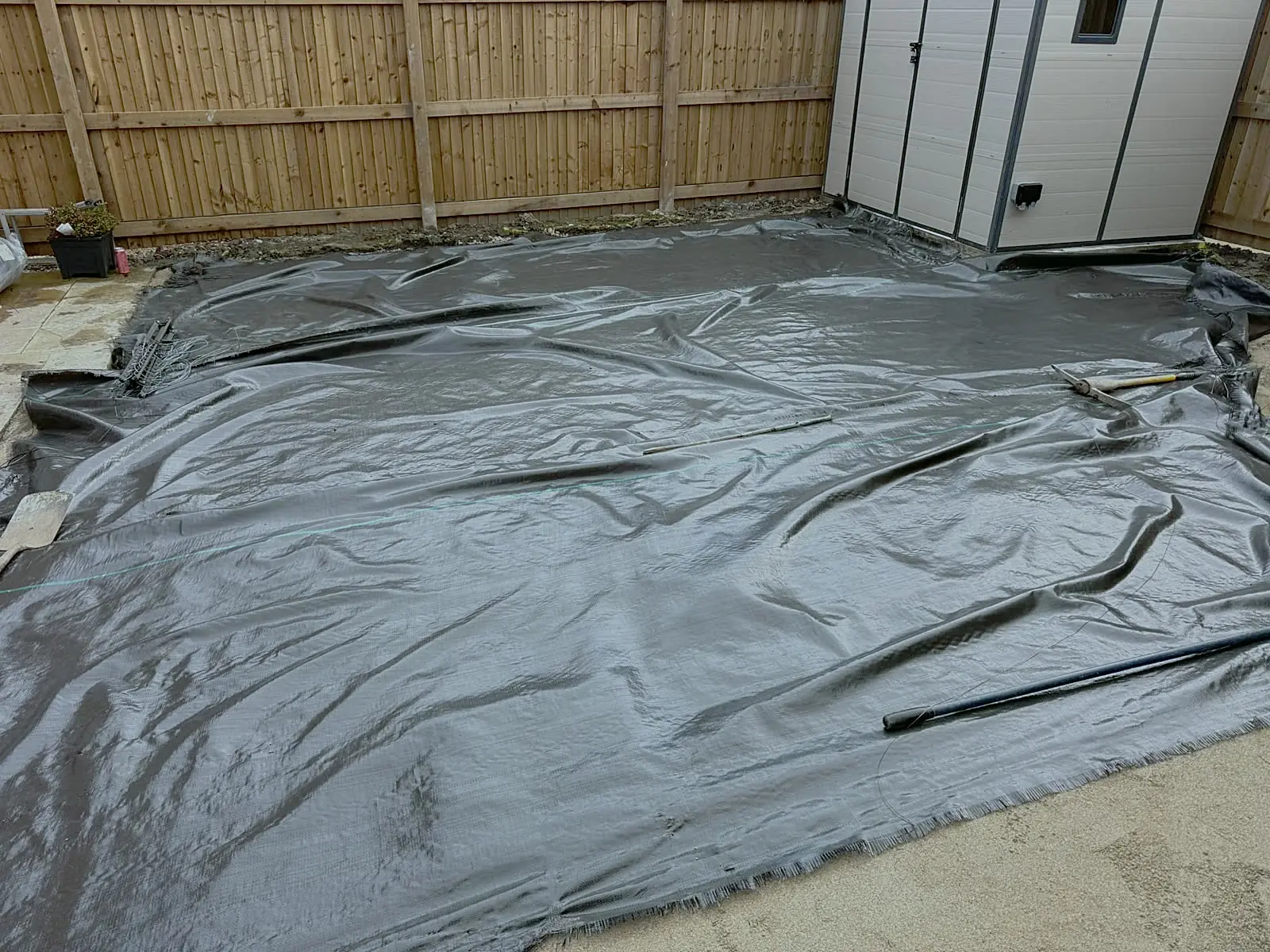 Membrane laid over a prepared garden area