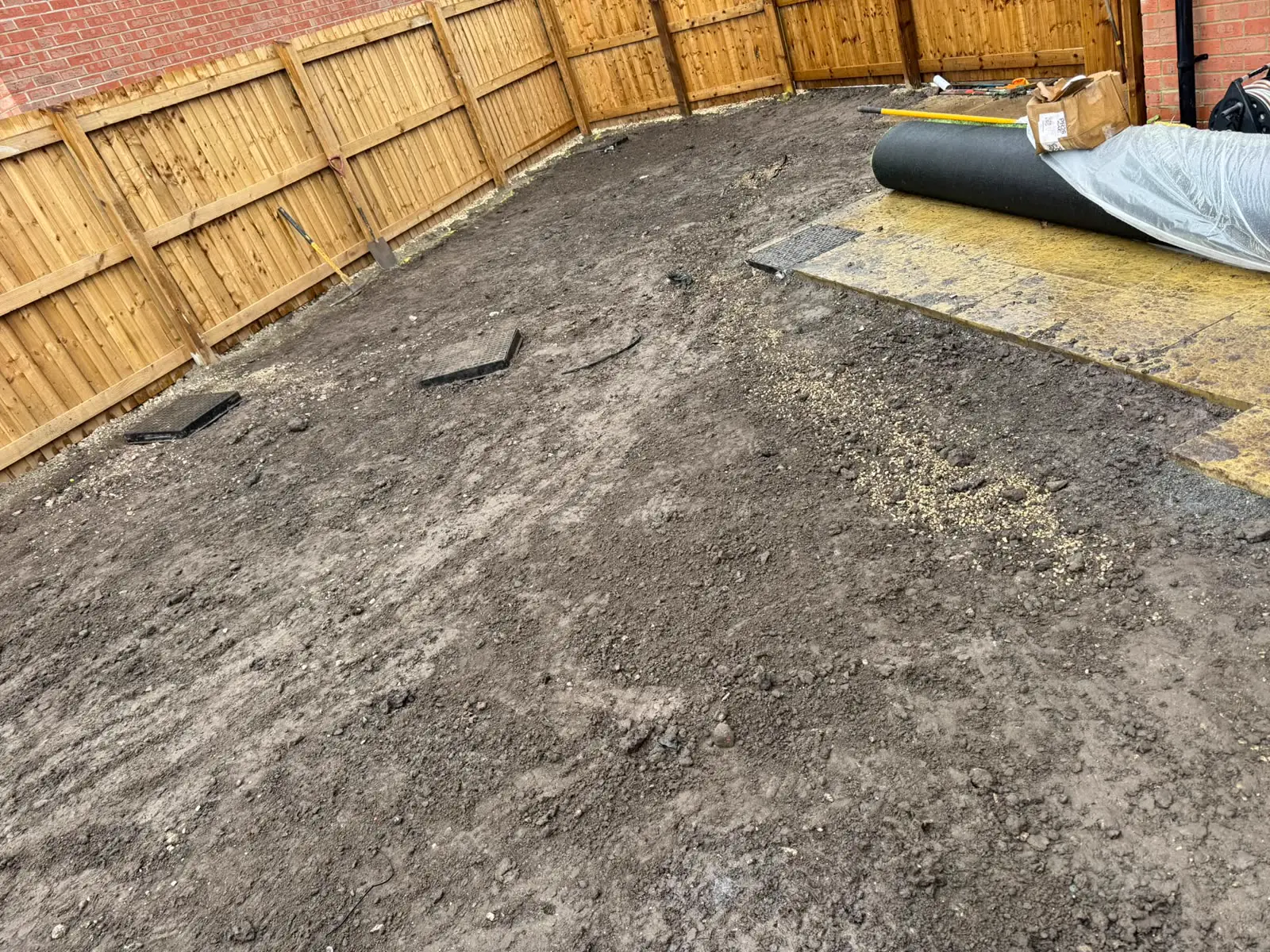 Levelled ground in a rear garden before artificial grass